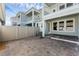 View of a fenced patio with brick flooring and a neighboring home at 13532 Autumn Harvest Ave, Winter Garden, FL 34787
