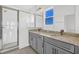 Modern bathroom featuring a double sink vanity and tiled walk-in shower at 13817 Luna Harvest Ave, Winter Garden, FL 34787