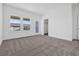 Bright bedroom features two windows and a glass door to the outdoors at 13817 Luna Harvest Ave, Winter Garden, FL 34787