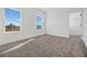 Bedroom featuring two bright windows and a neutral color palette at 13817 Luna Harvest Ave, Winter Garden, FL 34787