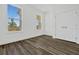 Cozy bedroom with wood-look floors, natural light, and closet at 13817 Luna Harvest Ave, Winter Garden, FL 34787