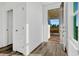Welcoming foyer with wood-look floors, bright lighting, and a view of the landscaped front yard at 13817 Luna Harvest Ave, Winter Garden, FL 34787