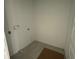 A walk-in pantry features tile flooring and ample space for storage at 13817 Luna Harvest Ave, Winter Garden, FL 34787