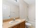 Bathroom with neutral walls, sink with vanity, toilet and tub with shower at 13832 Dove Wing Ct, Orlando, FL 32828