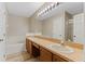 Bathroom with double vanity, large mirror, separate shower, and soaking tub, creating a relaxing space at 13832 Dove Wing Ct, Orlando, FL 32828