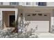Charming townhome featuring a one car garage and welcoming front door at 13832 Dove Wing Ct, Orlando, FL 32828