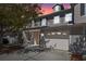 Charming townhouse exterior with a front balcony and attached garage, located in a vibrant community at 13832 Dove Wing Ct, Orlando, FL 32828