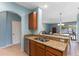 Well-appointed kitchen with granite countertops and a view of the lake at 13832 Dove Wing Ct, Orlando, FL 32828