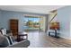 Comfortable living room with a sliding door and a peaceful lake view at 13832 Dove Wing Ct, Orlando, FL 32828