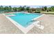 Large community pool with sun loungers and ample seating for residents to enjoy in the sunshine at 13832 Dove Wing Ct, Orlando, FL 32828