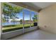 View from the screen porch, showing a picturesque lake with a fountain at 13832 Dove Wing Ct, Orlando, FL 32828