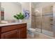 Well lit bathroom featuring a glass enclosed shower, granite countertops, and modern fixtures at 1395 Olympic Club Blvd, Champions Gate, FL 33896
