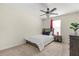 Comfortable bedroom featuring stylish ceiling fan, neutral decor, and ample natural light at 1395 Olympic Club Blvd, Champions Gate, FL 33896