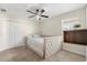Cozy bedroom featuring stylish ceiling fan, closet, and ample natural light at 1395 Olympic Club Blvd, Champions Gate, FL 33896