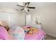 A bedroom that is decorated with pink bedding and a decorative vanity at 1395 Olympic Club Blvd, Champions Gate, FL 33896