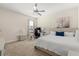 Inviting bedroom with neutral tones, plush carpet, a queen bed, and a ceiling fan at 1395 Olympic Club Blvd, Champions Gate, FL 33896
