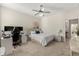 Comfortable bedroom with a queen-sized bed, neutral decor, and modern ceiling fan at 1395 Olympic Club Blvd, Champions Gate, FL 33896