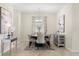 Bright dining room with tasteful decor and a view of the outdoors, creating a serene atmosphere for meals at 1395 Olympic Club Blvd, Champions Gate, FL 33896