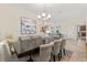 Elegant dining room featuring a large table perfect for hosting, with stylish decor and ample natural light at 1395 Olympic Club Blvd, Champions Gate, FL 33896