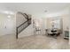 Spacious foyer featuring a staircase, dining area, tile flooring, and elegant decor at 1395 Olympic Club Blvd, Champions Gate, FL 33896