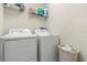 Efficient laundry room featuring a modern washer and dryer set plus additional storage space at 1395 Olympic Club Blvd, Champions Gate, FL 33896