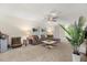 Cozy living room with neutral carpeting, contemporary decor, and ample natural light at 1395 Olympic Club Blvd, Champions Gate, FL 33896