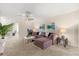 Inviting living room features neutral carpeting, ceiling fan, and modern decor at 1395 Olympic Club Blvd, Champions Gate, FL 33896