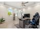 Bright office with a large window, tile flooring, and modern desk setup at 1395 Olympic Club Blvd, Champions Gate, FL 33896