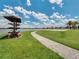 A lakeside access point offers kayak storage and a paved path leading to a lake with recreation opportunities at 15149 Canoe Pl, Winter Garden, FL 34787