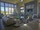 Clubhouse Lobby with stylish seating, modern decor, and floor-to-ceiling windows offering bright, natural light at 15149 Canoe Pl, Winter Garden, FL 34787