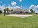 A playground with a sand base and covered play structures offers a fun and safe place for children to play at 15149 Canoe Pl, Winter Garden, FL 34787