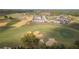 View of a golf course community that is developing new homes on expansive lots at 16048 Trivoli Cir, Bella Collina, FL 34756