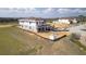 Home under construction with a golf course view has a large yard and an attached two car garage at 16048 Trivoli Cir, Bella Collina, FL 34756