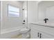 Modern bathroom featuring new shower/tub, vanity, and fixtures at 16745 Sw 29Th Terrace, Ocala, FL 34473