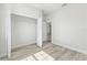 Bright, empty bedroom featuring wood floors and closet at 16745 Sw 29Th Terrace, Ocala, FL 34473