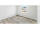 Bright, empty bedroom with hardwood floors and a large window with natural light at 16745 Sw 29Th Terrace, Ocala, FL 34473
