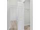 This closet features a wire shelf and connects to the bathroom at 16745 Sw 29Th Terrace, Ocala, FL 34473