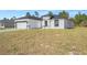 Exterior view showing the home's modern design, tidy landscaping, and inviting curb appeal at 16745 Sw 29Th Terrace, Ocala, FL 34473