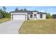 Charming single-story home featuring a two-car garage, neutral color palette and well-maintained landscaping at 16745 Sw 29Th Terrace, Ocala, FL 34473