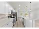 Modern kitchen featuring white cabinets, stainless steel appliances, and a large island at 16745 Sw 29Th Terrace, Ocala, FL 34473