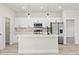 Modern kitchen featuring white cabinets, stainless steel appliances, and a large island at 16745 Sw 29Th Terrace, Ocala, FL 34473