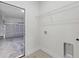 Spacious laundry room offers garage access, washer hookups and a storage shelf at 16745 Sw 29Th Terrace, Ocala, FL 34473