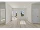 Bright and airy living room with new floors, white walls, and a view of the front yard at 16745 Sw 29Th Terrace, Ocala, FL 34473