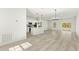 Spacious open-concept living space with modern lighting, sleek appliances, and a stylish kitchen island at 16745 Sw 29Th Terrace, Ocala, FL 34473