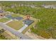 Aerial view of a new home in a tranquil neighborhood surrounded by lush greenery at 16753 Sw 29Th Terrace, Ocala, FL 34473