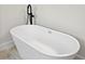 Modern bathroom featuring a sleek white bathtub with a stylish black faucet at 16753 Sw 29Th Terrace, Ocala, FL 34473