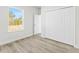 Bright bedroom with a window overlooking trees and a large closet providing ample storage at 16753 Sw 29Th Terrace, Ocala, FL 34473