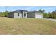 Inviting one-story home featuring a two-car garage and freshly laid lawn at 16753 Sw 29Th Terrace, Ocala, FL 34473