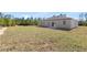 Expansive backyard view of the property showing a newly constructed patio space at 16753 Sw 29Th Terrace, Ocala, FL 34473