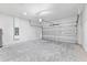 Spacious two-car garage with concrete block walls and a sectional garage door at 16753 Sw 29Th Terrace, Ocala, FL 34473